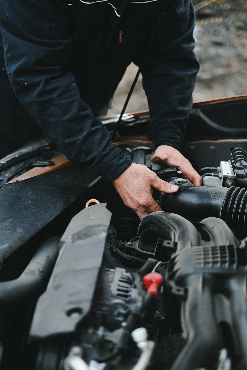 an auto mechanic repairing the car engine